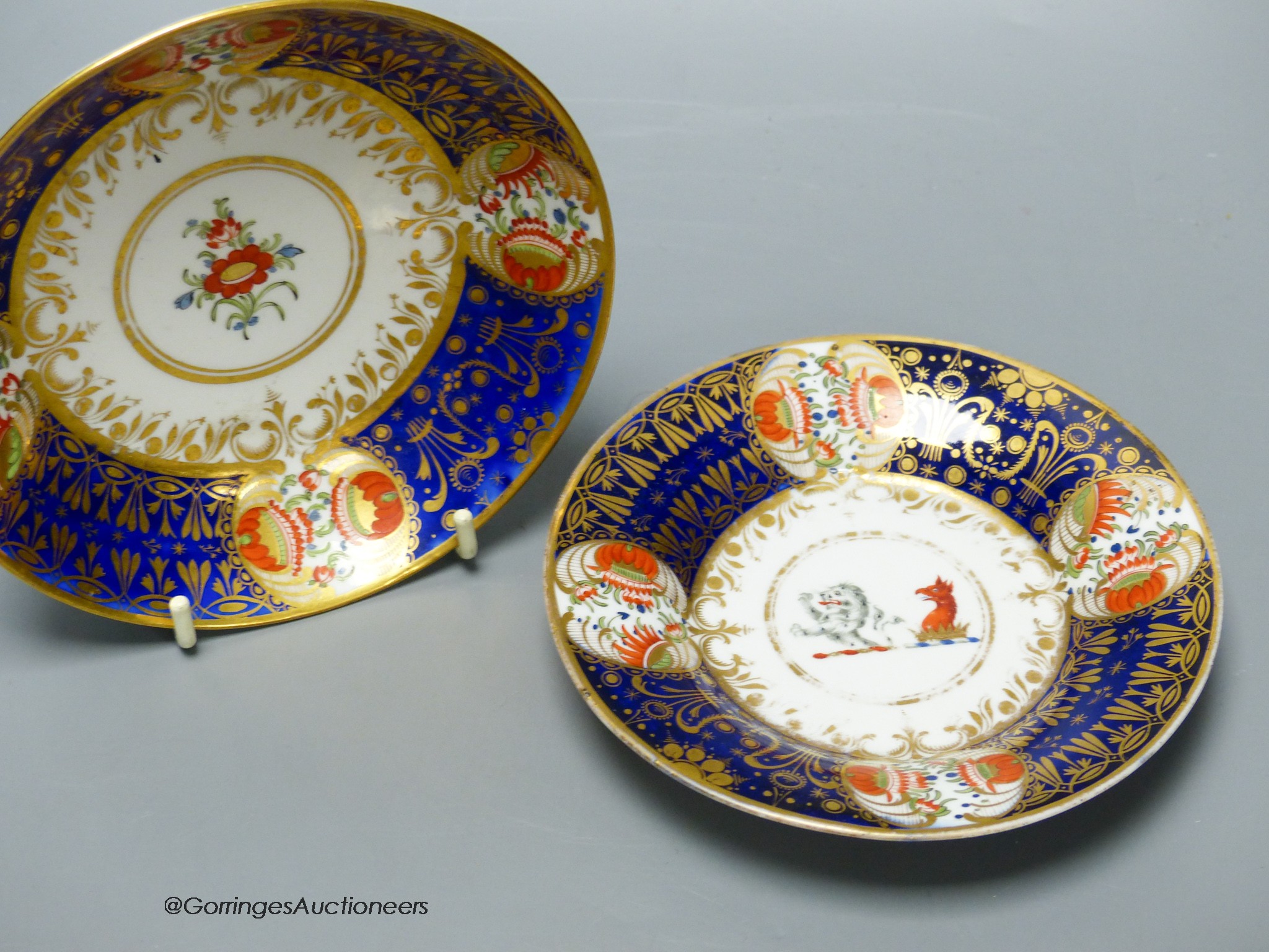 A Chamberlain armorial or crested cup and saucer in the style of the Yeo service and Chamberlain Worcester crested saucer